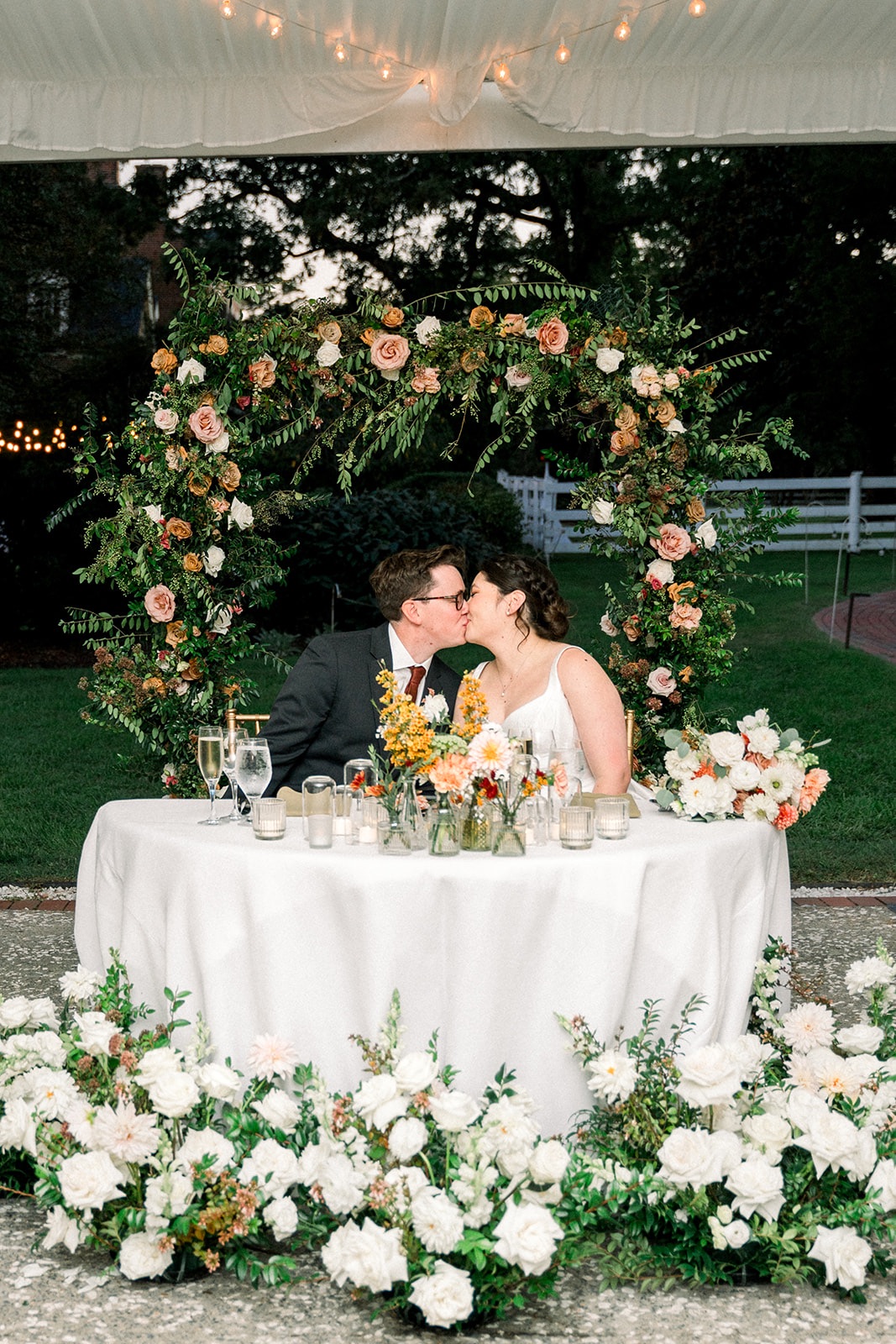 Newlyweds Share a Kiss at the Head Table - Woodlawn and Pope Leighey House